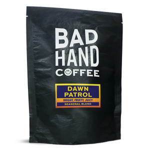 Two fifty gramme postal bag of Dawn Patrol, a seasonal blend - taste notes: bright, fruity, juicy. Roasted fresh to order from Bad Hand Coffee. Available as whole bean or ground to your brew method. These bags are 100% paper and home compostable. 