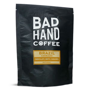 Two fifty gramme postal bag of Brazil Cerrado - taste notes: chocolate, nuts, caramel. Roasted fresh to order from Bad Hand Coffee. Available as whole bean or we can grind it to suit your home brew method. These bags are 100% paper and home compostable. 