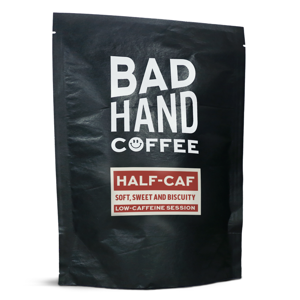 Two fifty gramme postal  bag of Half-Caf, low caffeine session coffee - taste notes: soft, sweet and biscuity. Roasted fresh to order from Bad Hand. Available as whole bean or ground to your home brew method. These bags are 100% paper and home compostable. 