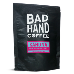 Two fifty gramme postal bag of Kahuna, a blend of coffees from Brazil with taste notes of cocoa, hazelnut and treacle, roasted fresh to order from Bad Hand Coffee. Available as whole bean or ground to your brew method. These bags are 100% paper and home compostable. 