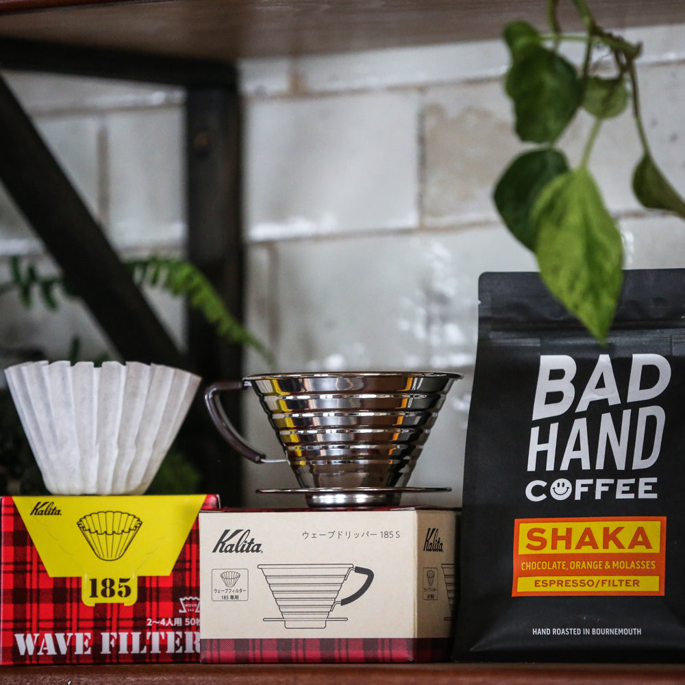 kalita wave brewer, kalita wave filter papers and a bag of 250 gram shaka from Bad Hand Coffee sold as a bundle