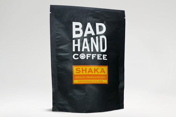 Bad Hand Coffee - Two fifty gramme postal bag of Shaka, our house espresso filter blend - taste notes: chocolate, orange and molasses. Hand roasted and fresh to order. Available as whole bean or ground to your brew method. These bags are 100% paper and home compostable.