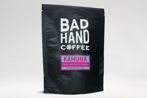 Bad hand coffee - Two fifty gramme postal bag of Kahuna, a blend of coffees from Brazil with taste notes of cocoa, hazelnut and treacle, hand roasted and fresh to order. Available as whole bean or ground to your brew method. These bags are 100% paper and home compostable.